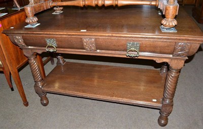 Lot 513 - Late Victorian two-tier oak table with turned legs