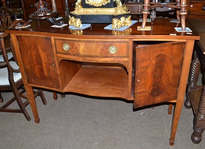 Lot 515 - Edwardian mahogany inlaid serpentine sideboard