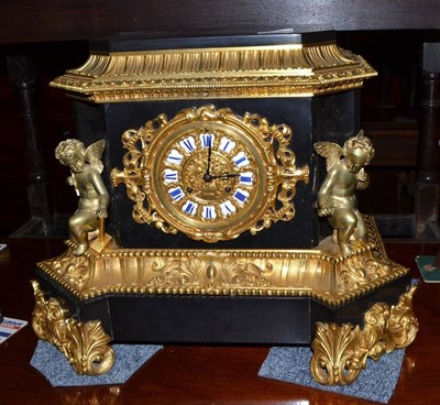 Lot 516 - An ormolu and black slate striking mantel clock, circa 1880, winged cherubs and ormolu scroll...