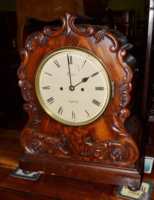 Lot 550 - A mahogany striking table clock, circa 1830, applied scroll and floral decoration, 7-1/2-inch...