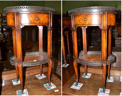 Lot 555 - Pair of reproduction oval two-tier occasional tables with metal mounts