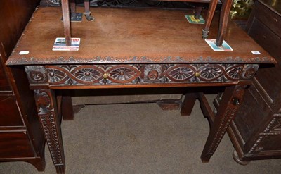 Lot 564 - A carved Anglo-Indian single drawer hardwood side table