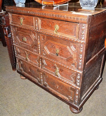 Lot 565 - Oak moulded front chest of drawers