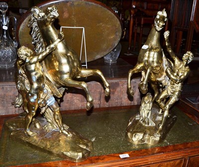 Lot 568 - A pair of brass Marley horses