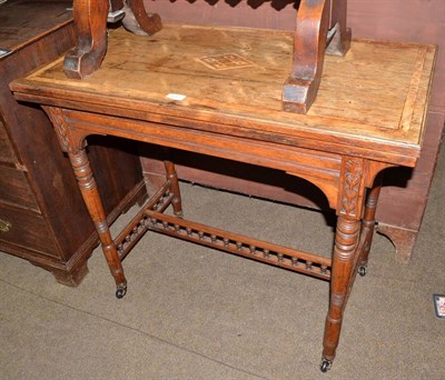 Lot 572 - Rosewood fold-over card table