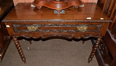 Lot 577 - Carved oak single drawer side table