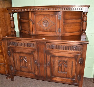 Lot 588 - A reproduction oak court cupboard