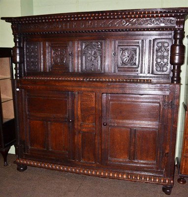 Lot 590 - An 18th century and later carved oak court cupboard