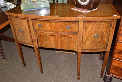 Lot 599 - A mahogany bow fronted sideboard with key