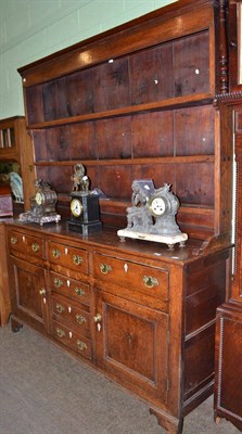 Lot 607 - An 18th century oak dresser and rack