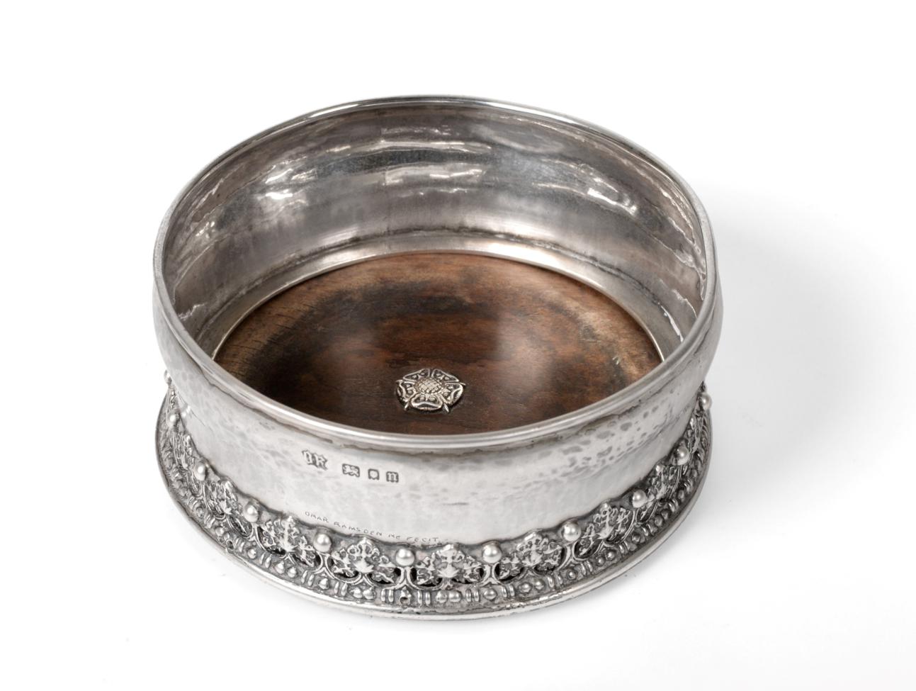 Lot 509 - An Arts & Crafts Silver Wine Coaster, Omar Ramsden, London 1928, with spot-hammered finish and...