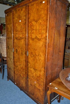 Lot 644 - Early 20th century walnut triple wardrobe and a mahogany drop-leaf table