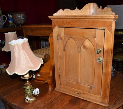 Lot 649 - Pine cupboard, three tables, stool, three lamps and cut glass