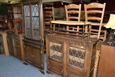 Lot 650 - Reproduction oak bureau, corner cabinet, bookcase, rush seat stool, dresser and rack, nest of...