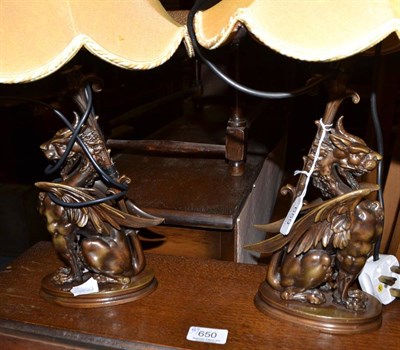 Lot 659 - A pair of decorative modern table lamps modelled as griffins