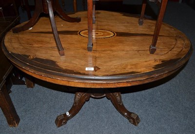 Lot 671 - A Victorian walnut oval breakfast table