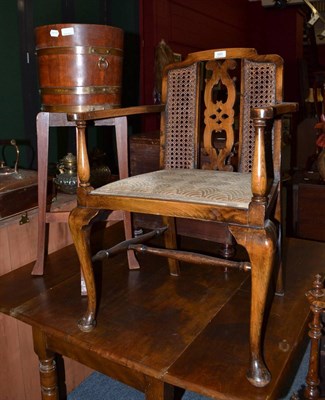 Lot 685 - An R A Lister & Co oak brass bound jardiniere on stand and an armchair