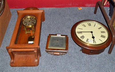 Lot 714 - A wall timepiece, a striking wall clock and an aneroid barometer