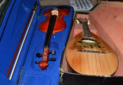 Lot 734 - A cased violin and a cased mandolin