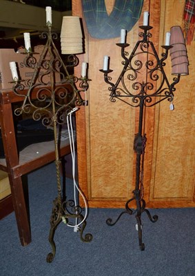 Lot 744 - A pair of wrought iron lamps