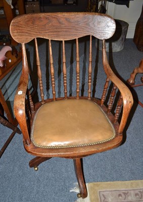 Lot 749 - An oak office chair