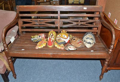 Lot 752 - A teak garden bench