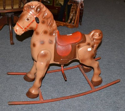 Lot 797 - A tin plate rocking horse