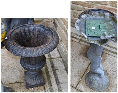 Lot 800 - Small cast iron pedestal urn, grate, figural cherub bird bath, sundial (4)