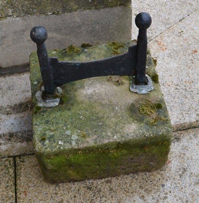 Lot 802 - Cast iron boot scraper on stone base