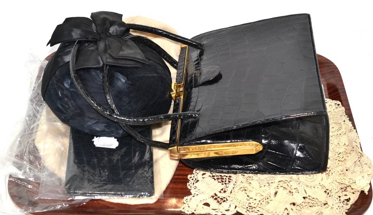 Lot 58 - Asprey black leather wallet, black leather handbag, feather and net hat and a lace collar
