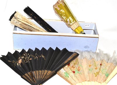 Lot 59 - Eight assorted 19th century and later fans and a feather mounted hair clip in a card fan box