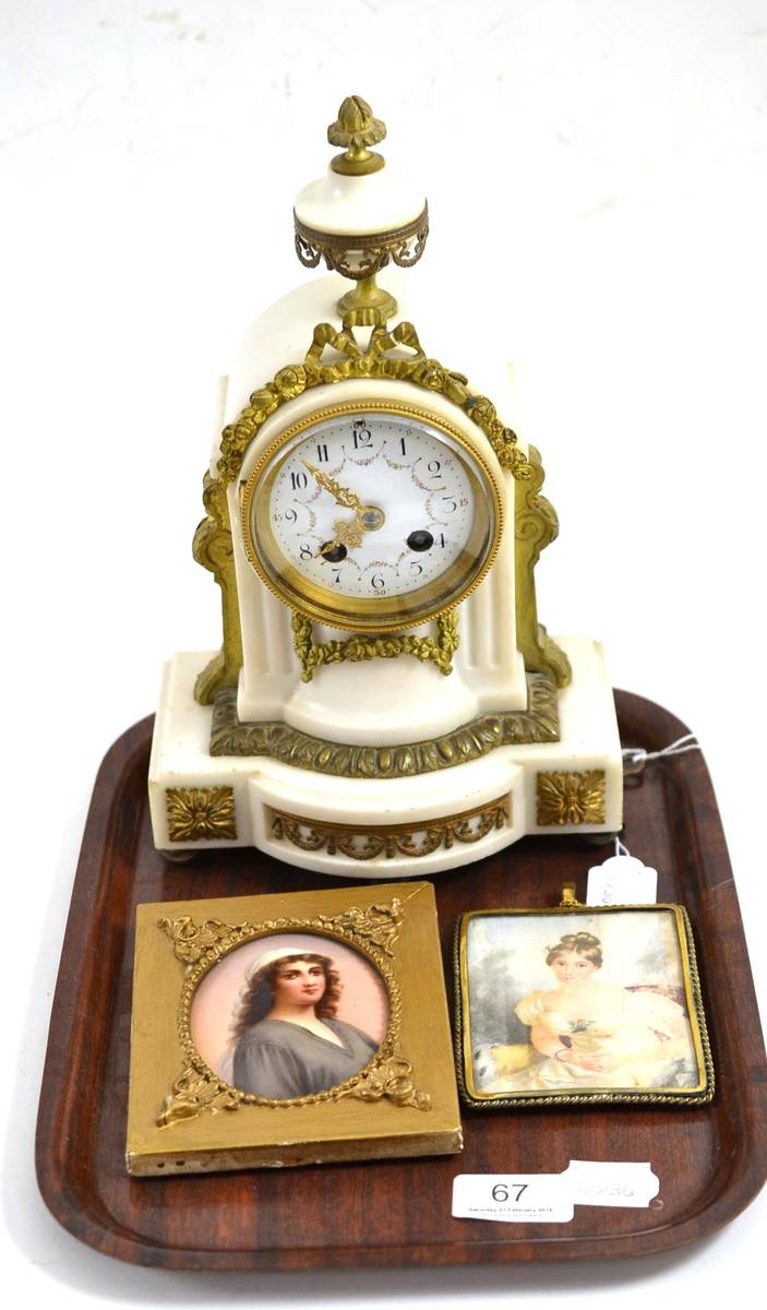 Lot 67 - A gilt metal mounted mantel clock with enamel dial and key, small framed portrait miniature on...