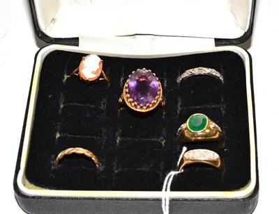 Lot 99 - A cameo ring stamped '9CT', a 9ct gold amethyst ring, a 9ct gold stone set ring, a 9ct gold diamond