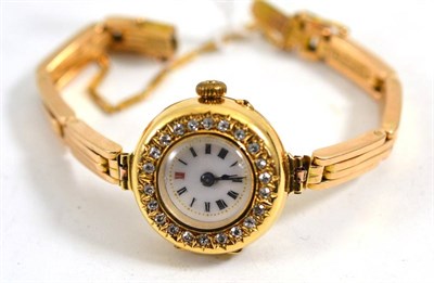 Lot 104 - A lady's diamond set wristwatch, case stamped '18', with attached bracelet with clasp stamped...