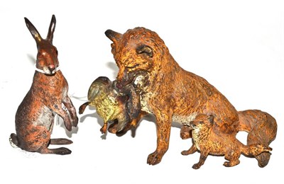 Lot 154 - A cold painted bronze fox, cub and duck group and a cold painted bronze hare