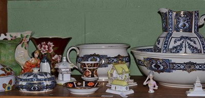 Lot 179 - A Wedgwood toilet set, five Coalport cottages, two jugs, a vase, a Royal Crown Derby saucer, a Wade