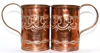 Lot 554 - A Pair of Irish Arts & Crafts Copper Tankards, by Fivemiletown Art Works, decorated with...