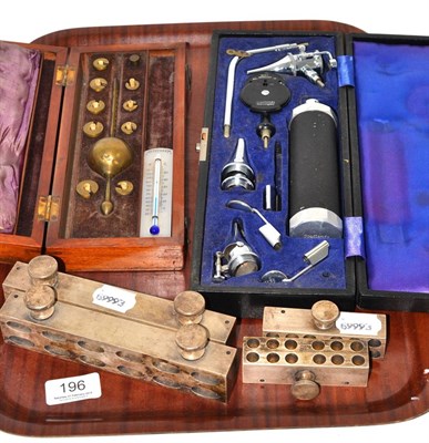 Lot 196 - Cased ophthalmoscope, four suppository moulds and cased Sike's hydrometer