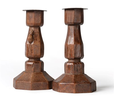 Lot 558 - A Pair of Robert  "Mouseman " Thompson Oak Candlesticks, octagonal column and bases, each with...