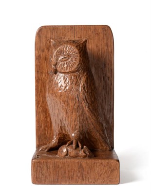 Lot 559 - A Robert  "Mouseman " Thompson Oak Table Brush Holder, carved as an owl holding a mouse in it's...