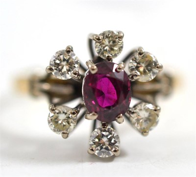 Lot 236 - A ruby and diamond cluster ring