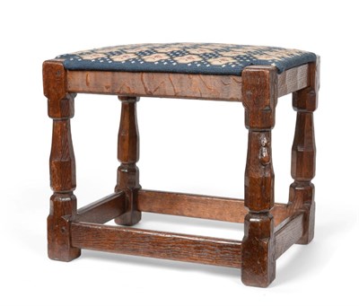 Lot 560 - A Robert  "Mouseman " Thompson Oak Stool, with later tapestry upholstered drop in seat, on four...