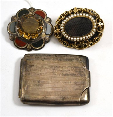 Lot 259 - A Sottish silver brooch, a Victorian mourning brooch and a silver vesta case