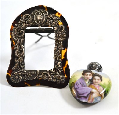 Lot 267 - Miniature tortoiseshell easel frame with silver mount and a heart shaped scent bottle printed...