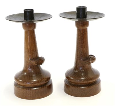 Lot 564 - A Pair of Robert  "Mouseman " Thompson Oak Candlesticks, each with wrought-iron drip trays,...