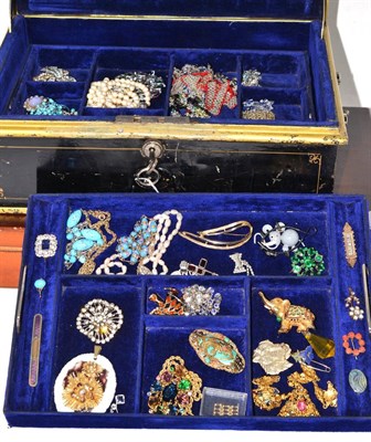 Lot 302 - A large quantity of costume jewellery including coral, beads, brooches etc in a jewellery box...