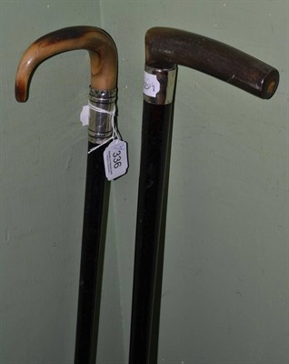 Lot 336 - An ebony cane with bone handle and another with horn handle