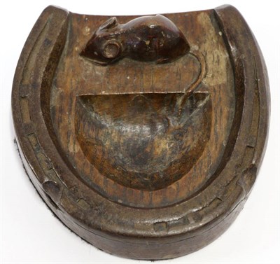 Lot 572 - A Robert  "Mouseman " Thompson Oak Horseshoe Pin Tray, mounted with an iron horseshoe, with...