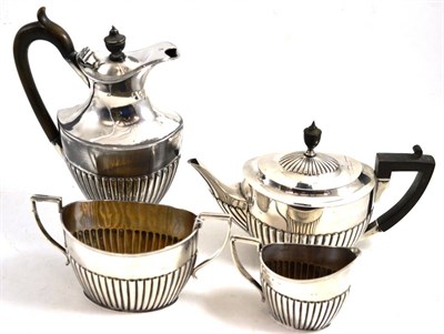 Lot 365 - Silver teapot and matching silver milk jug and sugar bowl, together with a plated hot water jug (4)