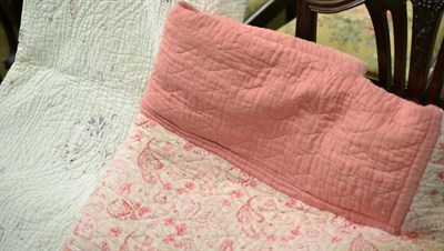 Lot 376 - White quilt with purple floral sprigs, 215cm x 245cm; and a pink quilt with bands of floral...